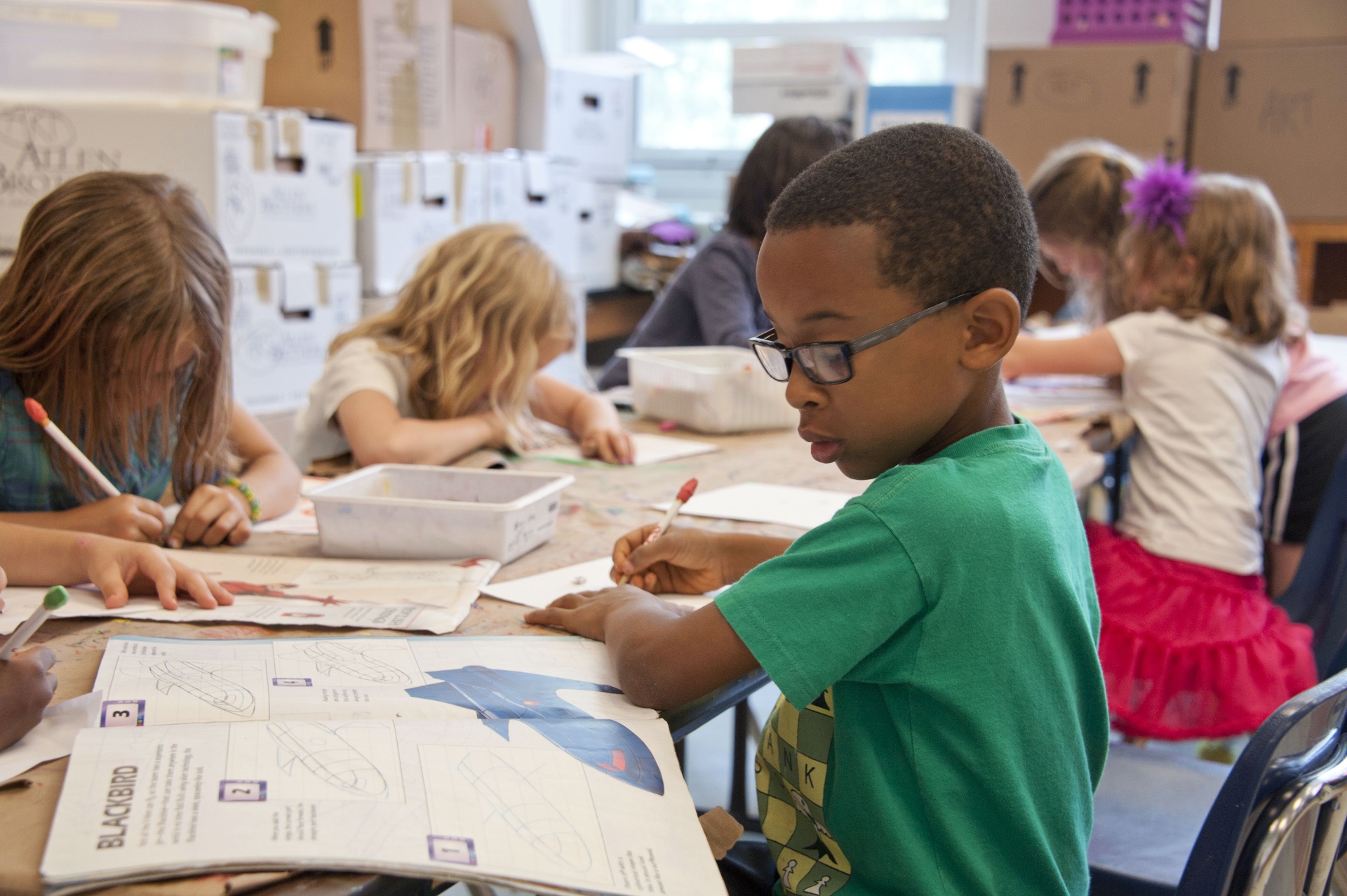 Elementary students working together during classroom learning time